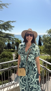 Sandra Hodes wearing a sun hat in a garden overlook